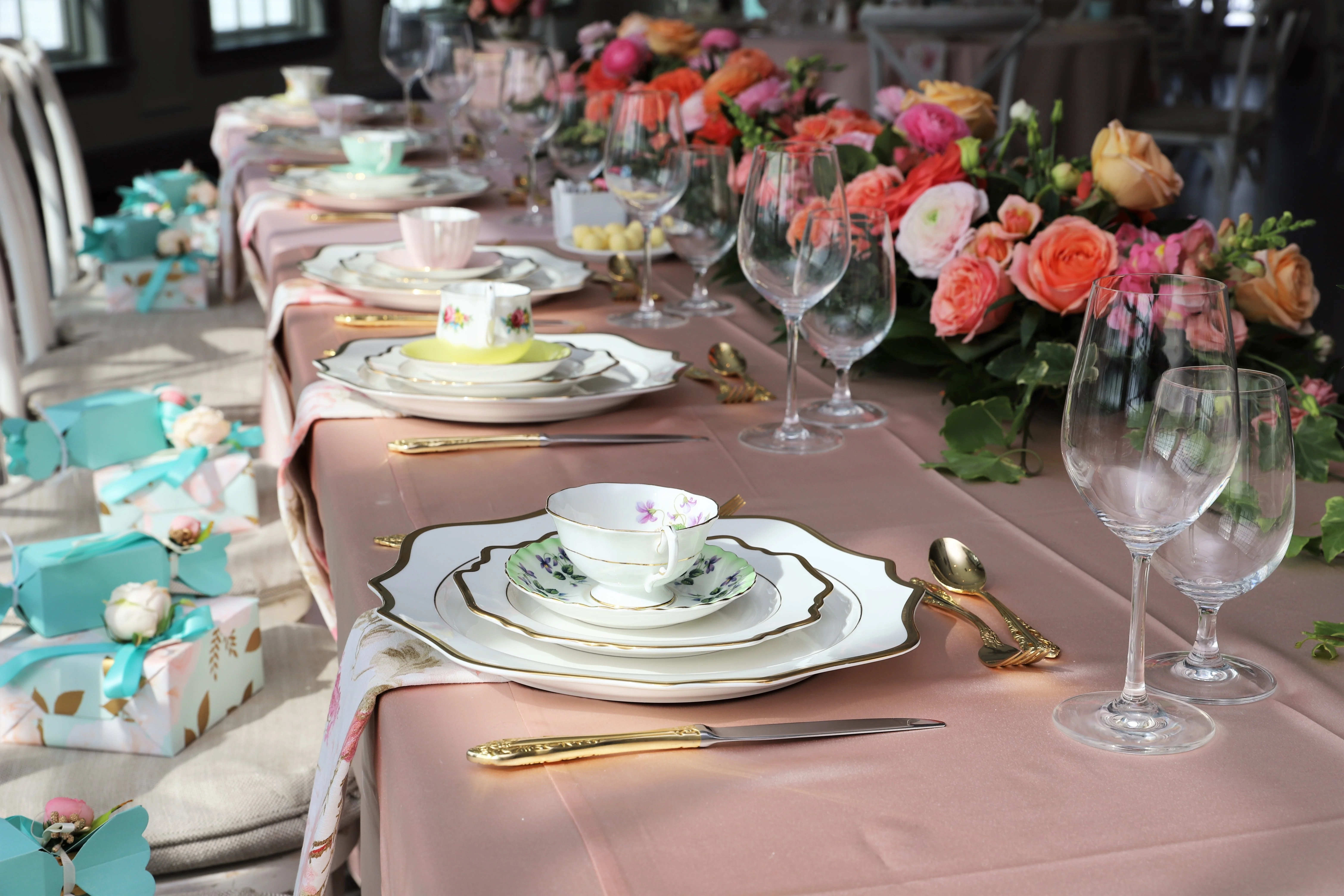 A beautifully arranged table with gourmet dishes and elegant tableware.