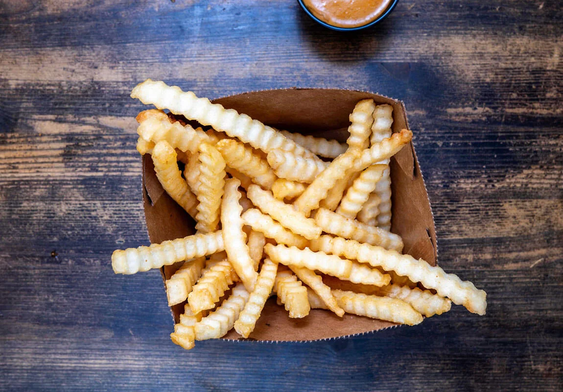 Crispy crinkle-cut fries served with dipping sauce