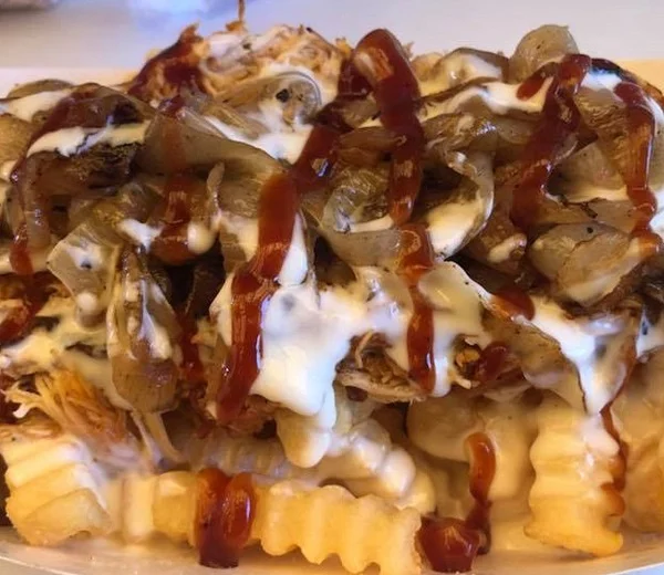 Loaded chicken fries with grilled onions and sauces