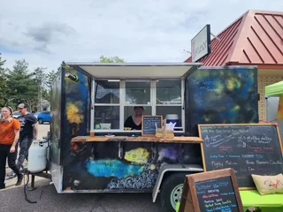 Colorful food truck serving diverse cuisine
