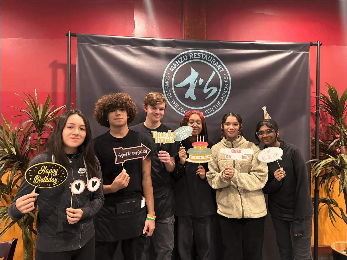 Mahzu East Windsor staff group photo with birthday props