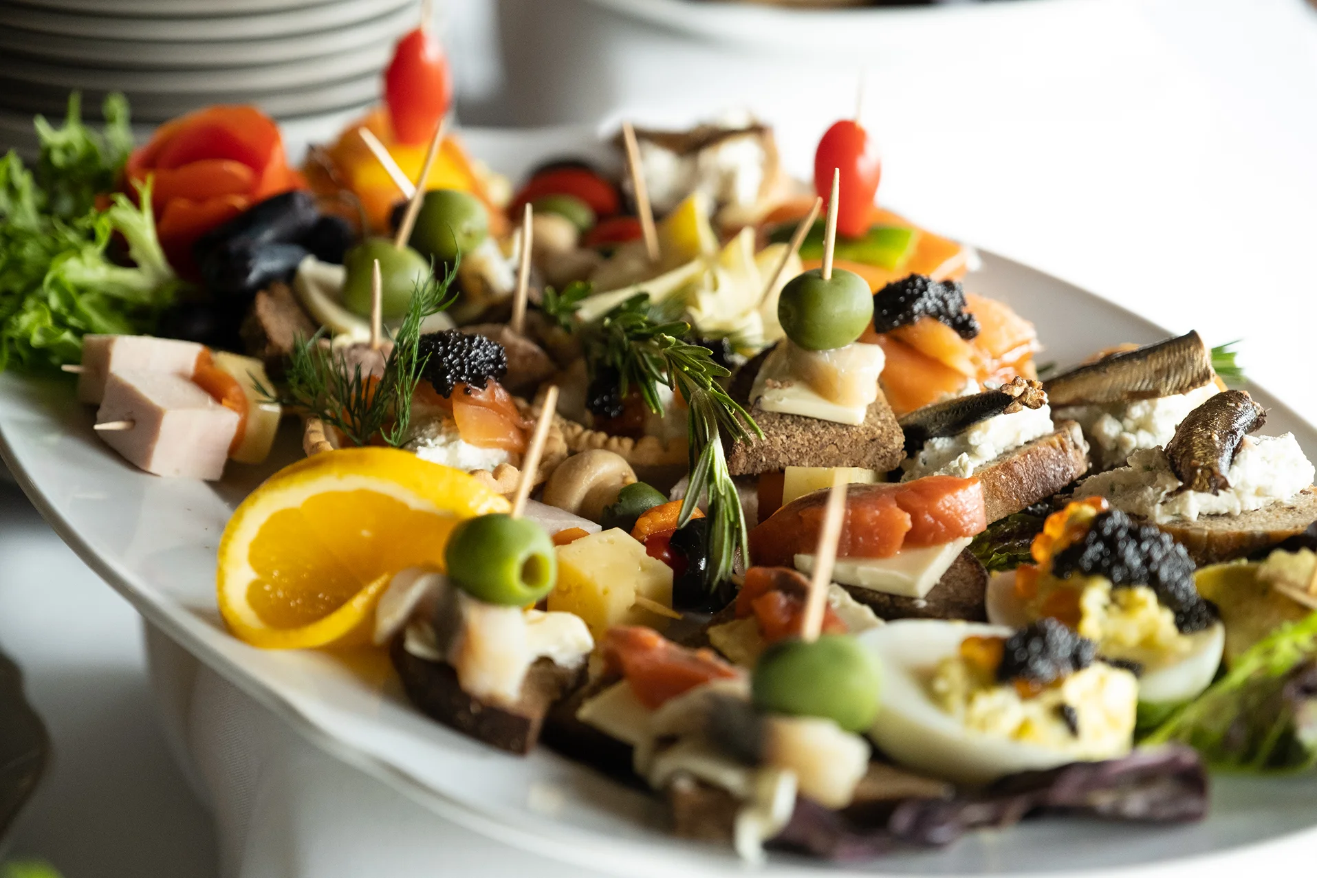 Assorted Russian zakuski platter with various appetizers