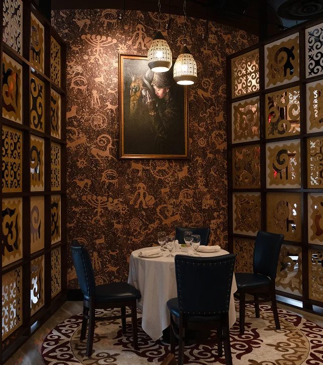 Elegant restaurant corner with artistic decor and intimate dining setup