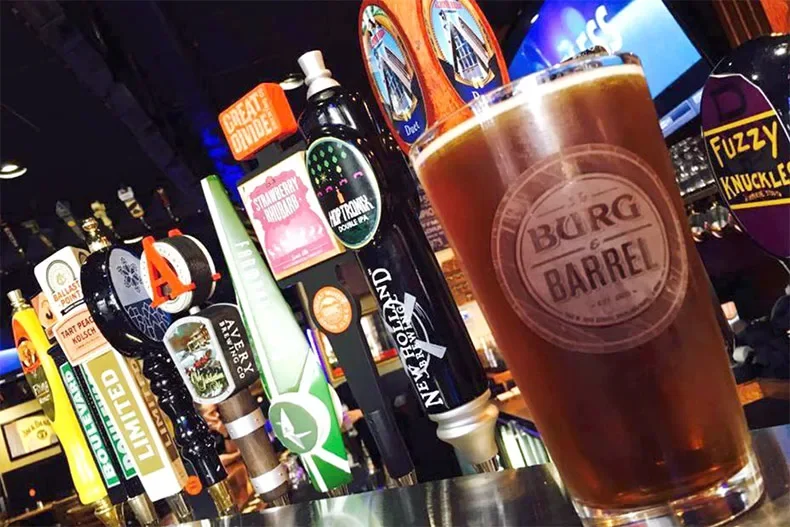 Craft beer selection at a vibrant bar with a pint in focus