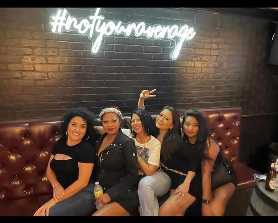 Group of friends enjoying a night out in a stylish bar setting
