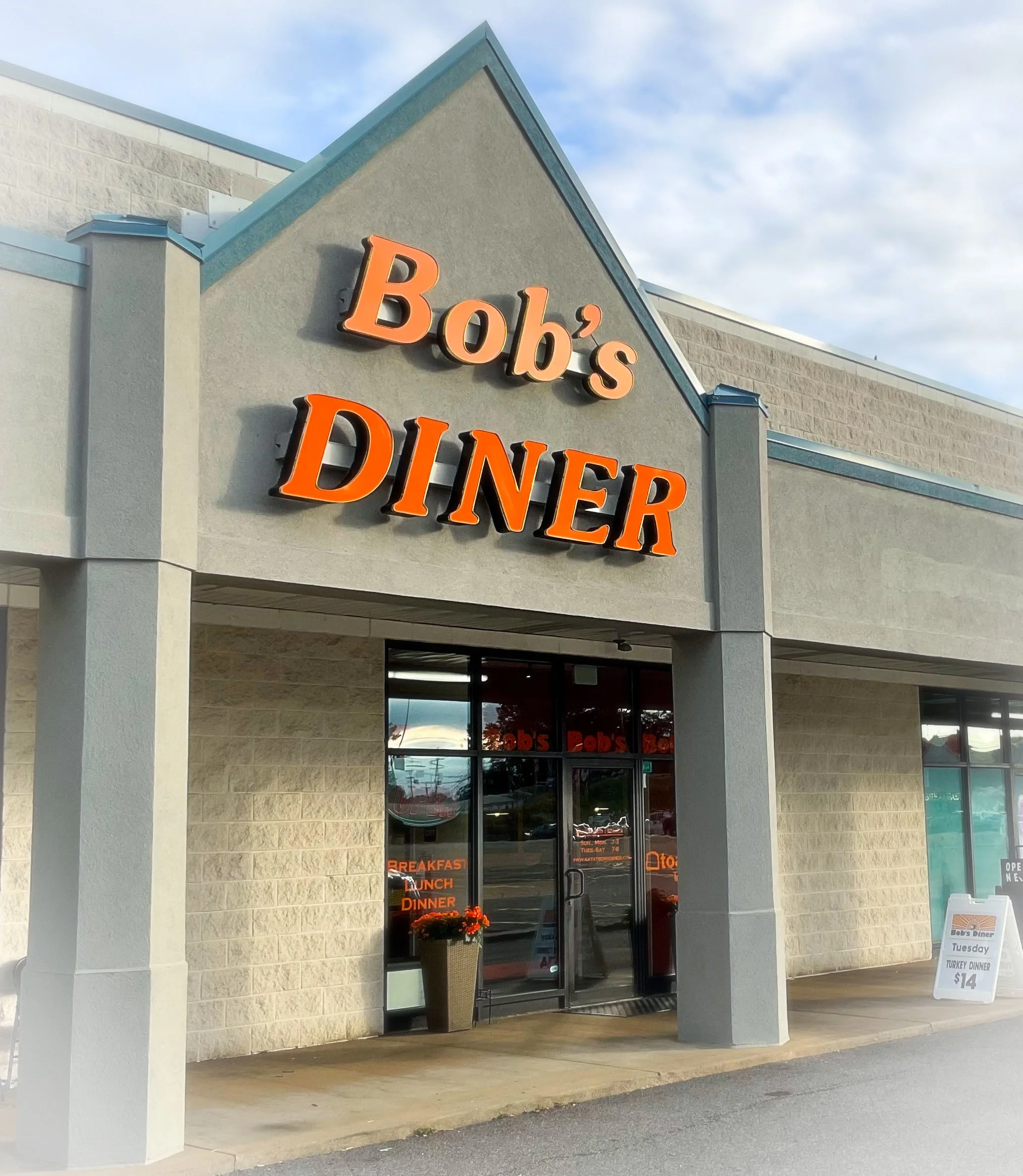 Exterior view of Bob's Diner with bright signage