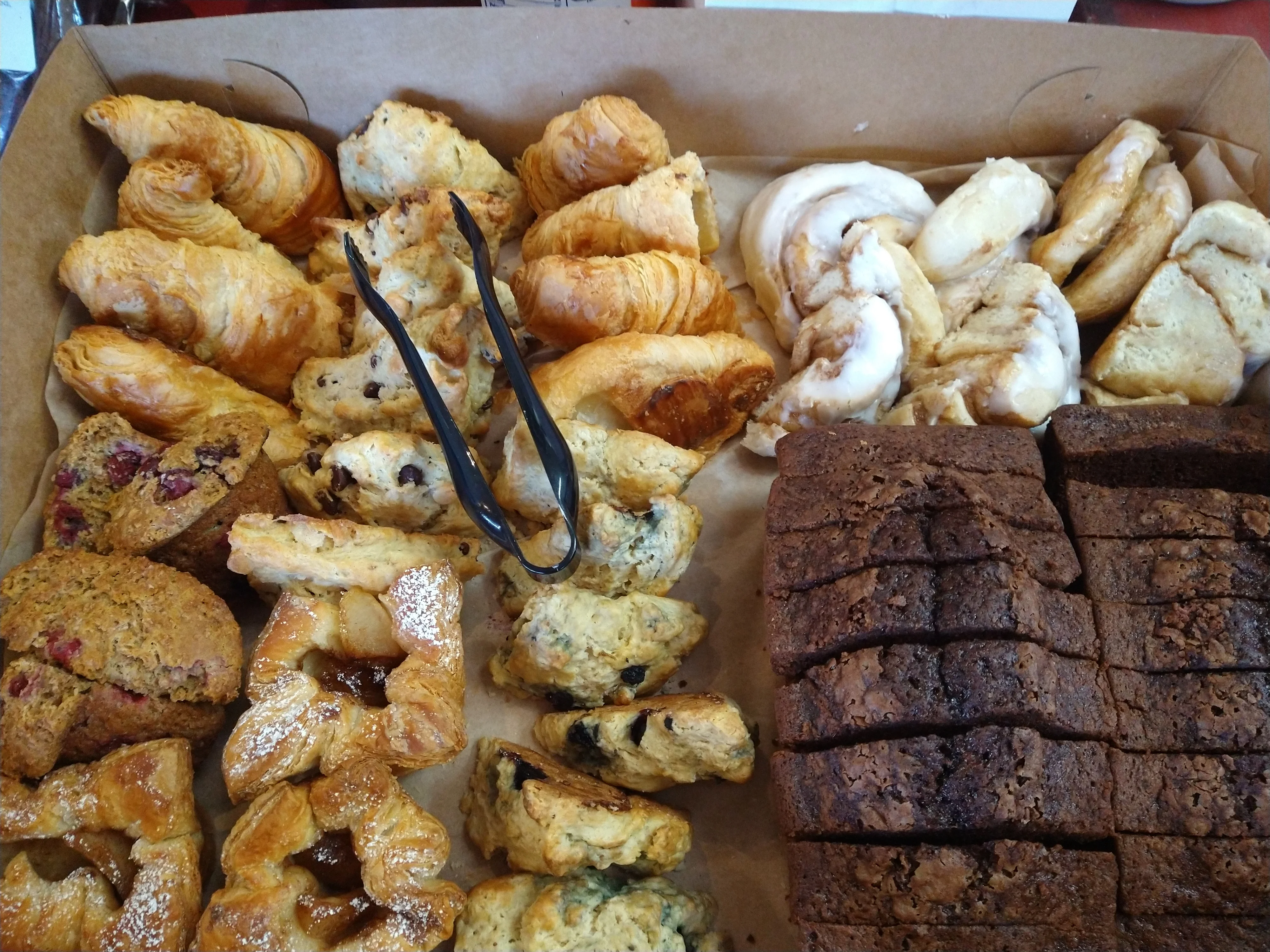 Assorted pastries including croissants and cinnamon rolls