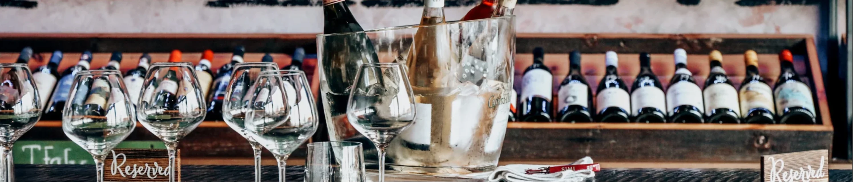 Elegant wine display with glasses and bottles in a stylish restaurant setting