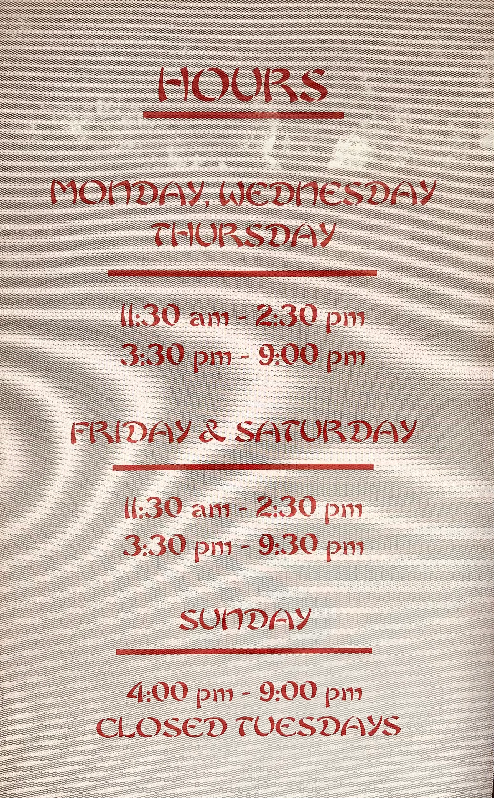 Restaurant hours sign detailing operating times