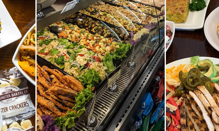 Assorted deli platters featuring bagels, salads, and sandwiches
