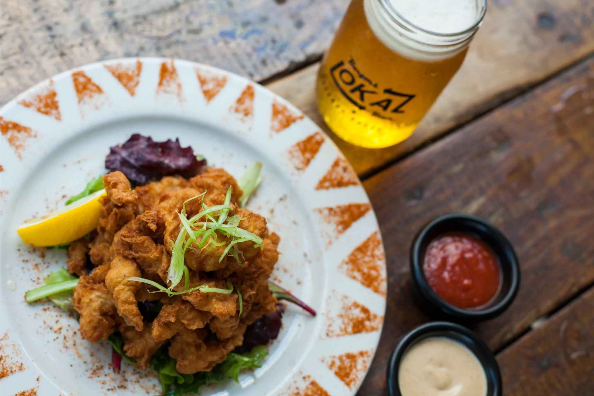 Southern fried chicken served with lemon and dipping sauces