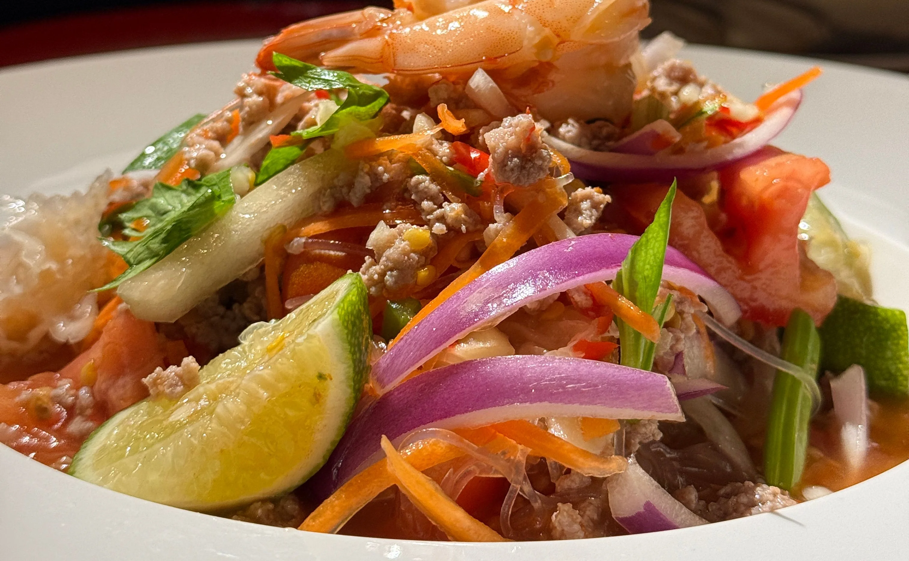 Thai shrimp salad with fresh herbs and vegetables