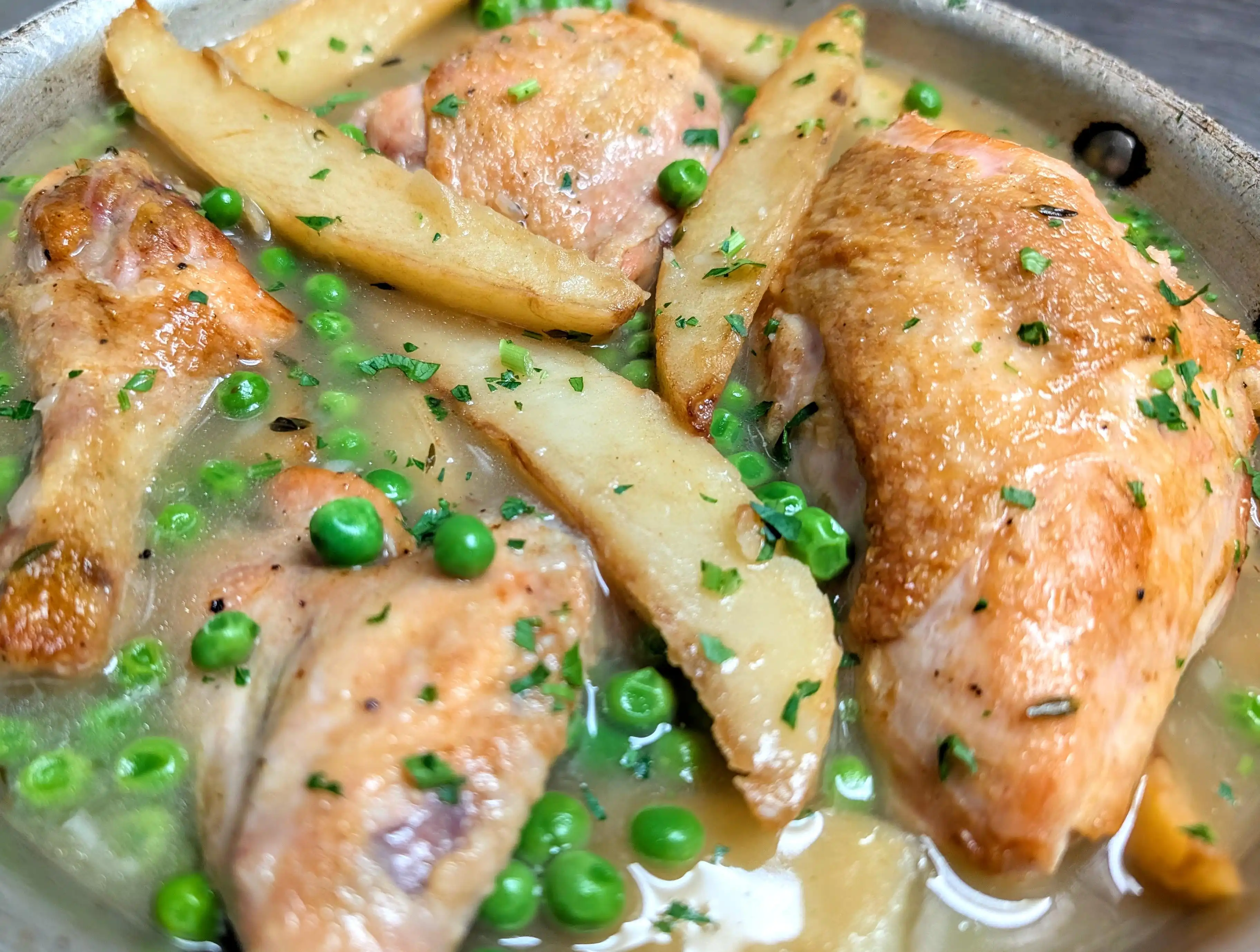 chicken vesuvio with potatoes and green peas