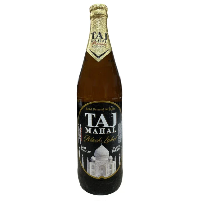 A bottle of Taj Mahal Black Label beer on a wooden table.