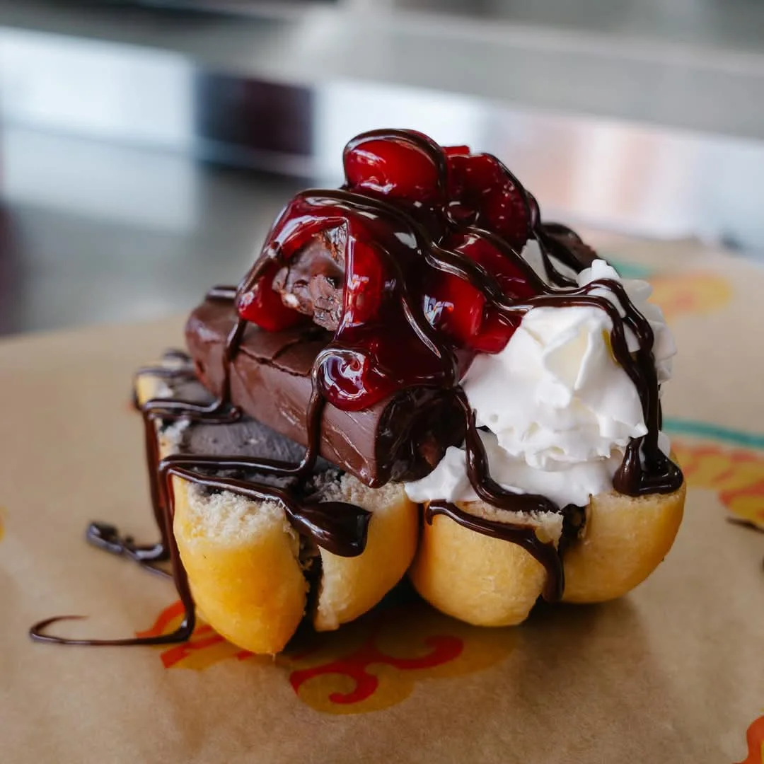 Decadent chocolate sundae with cherries and whipped cream