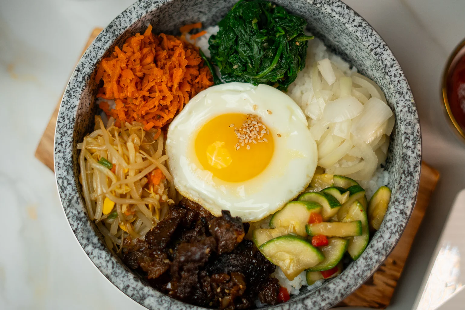 Korean bibimbap served in a hot stone bowl