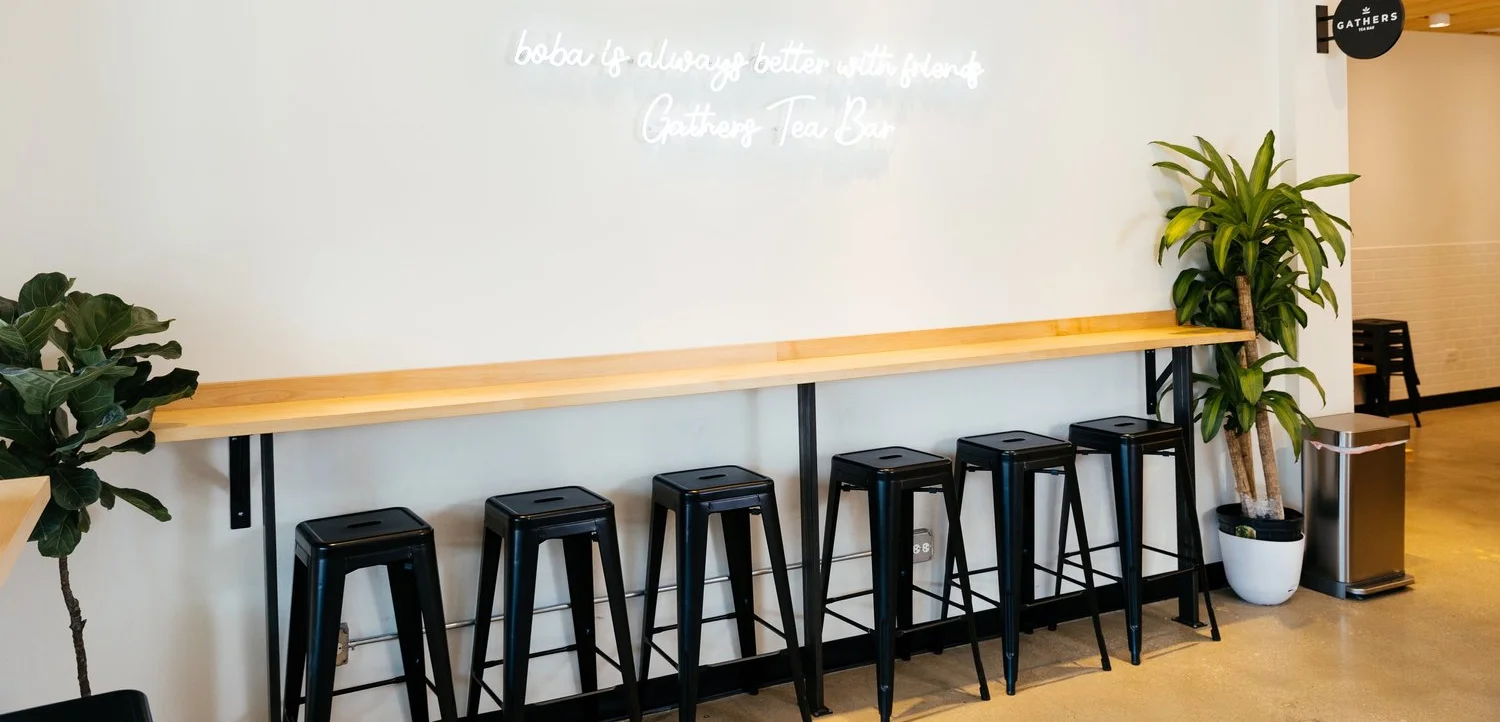 Modern tea bar interior with neon sign