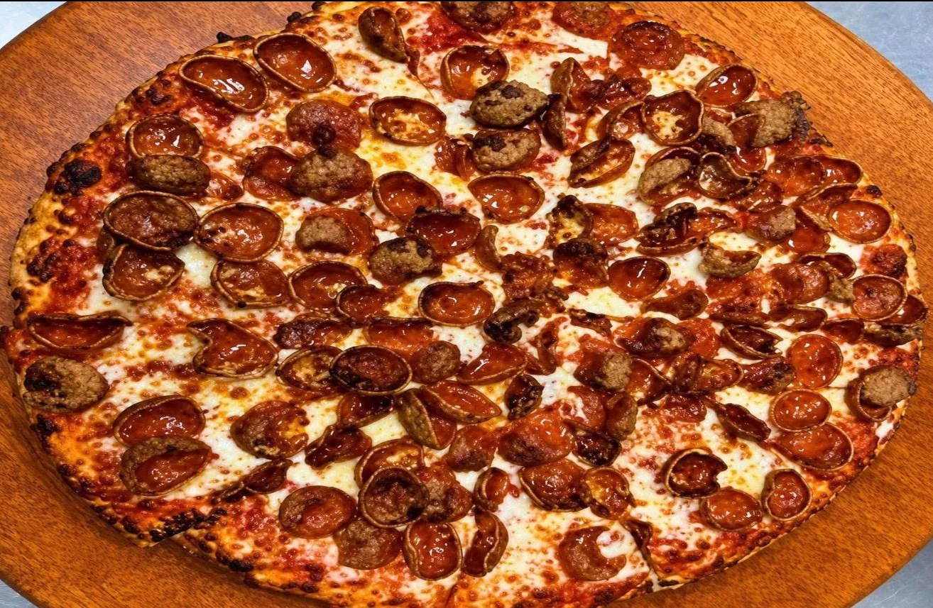 Loaded meat lover's pizza with various toppings