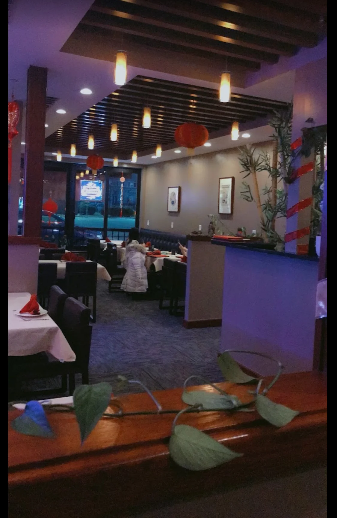 Cozy Asian restaurant interior with warm lighting and decorative elements