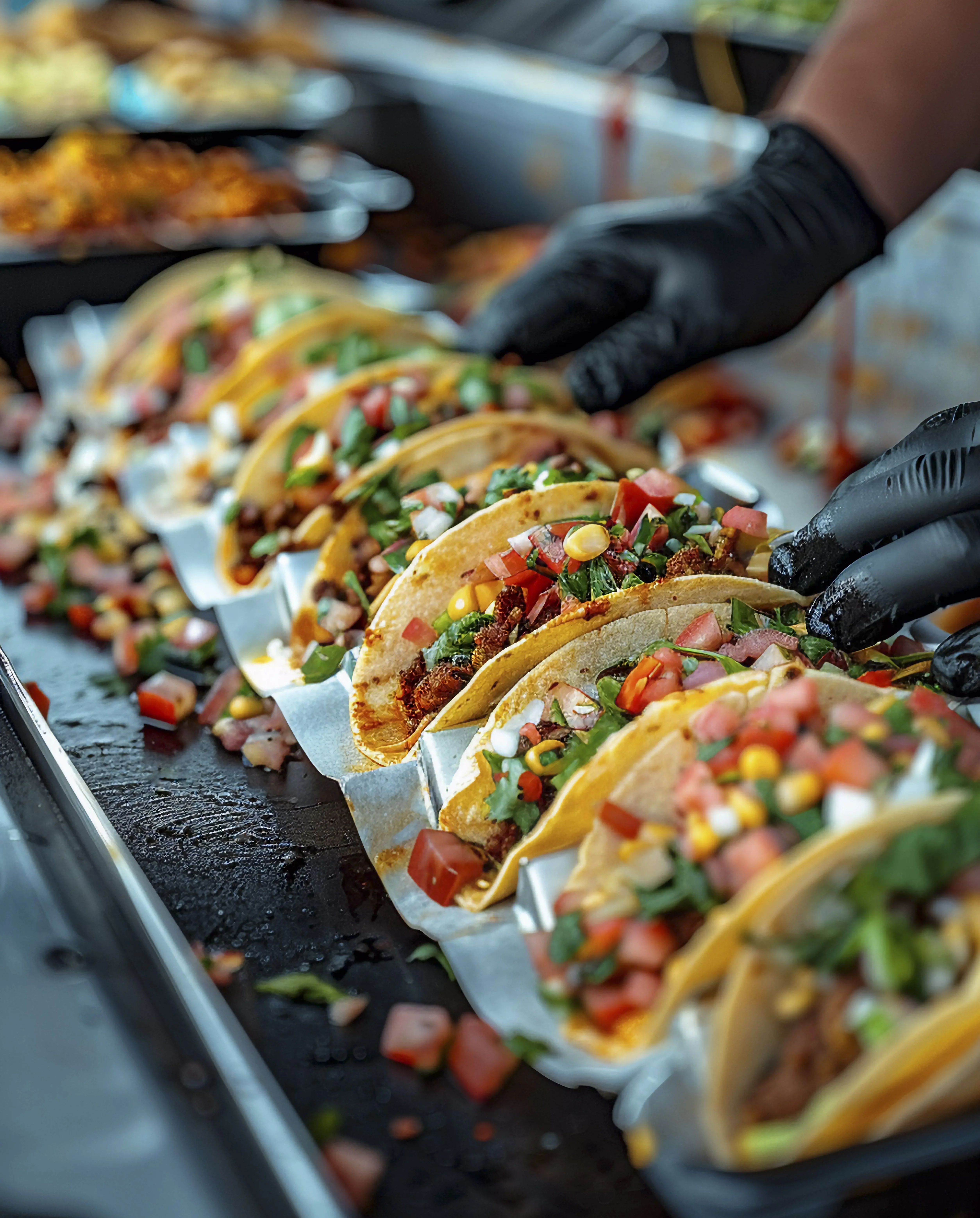Colorful tacos displayed on a food truck serving delicious Mexican cuisine.
