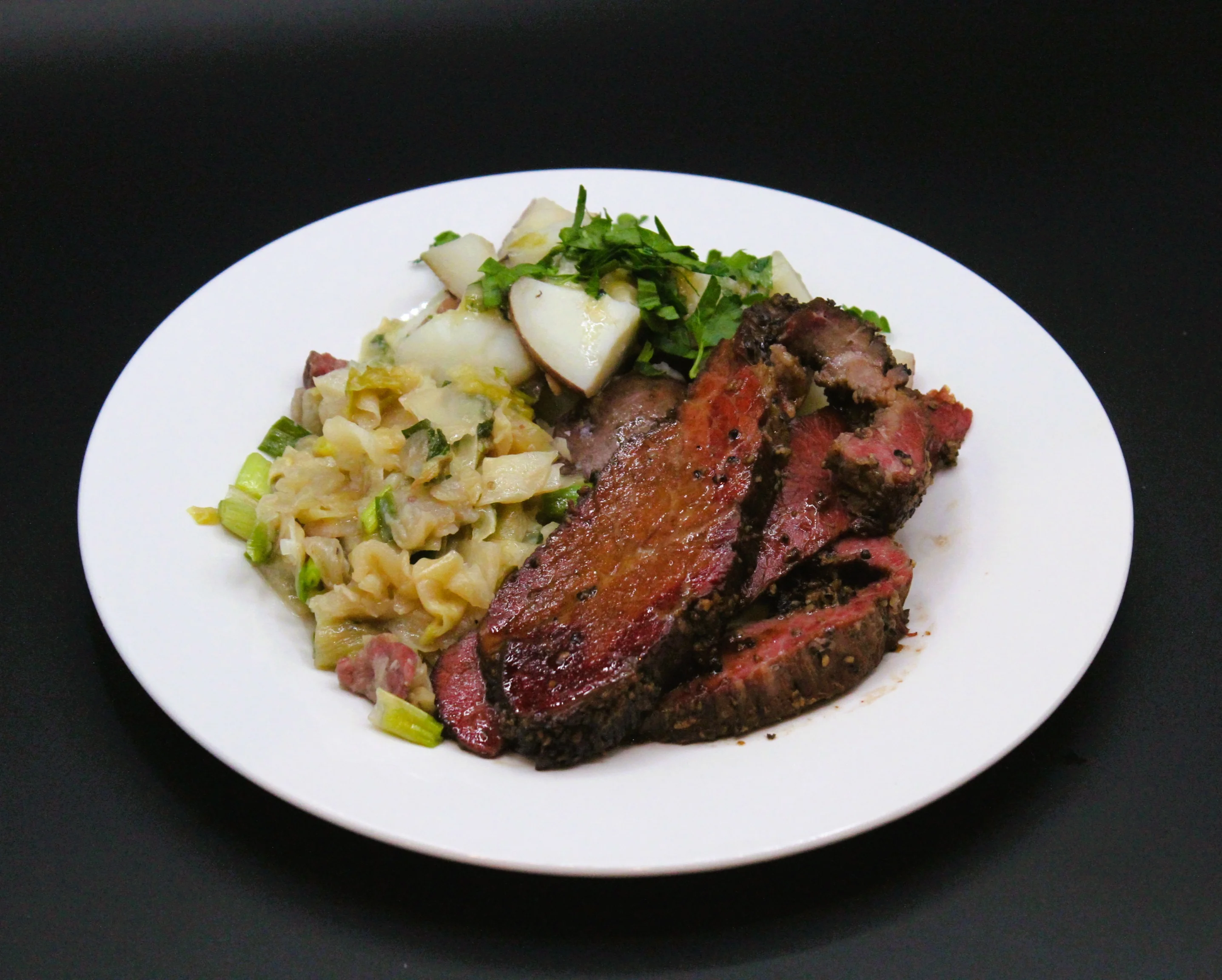 Sliced brisket with cabbage and potatoes, a classic comfort dish