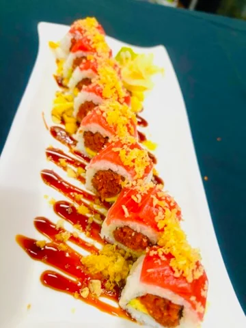 Japanese sushi rolls with spicy tuna and eel sauce