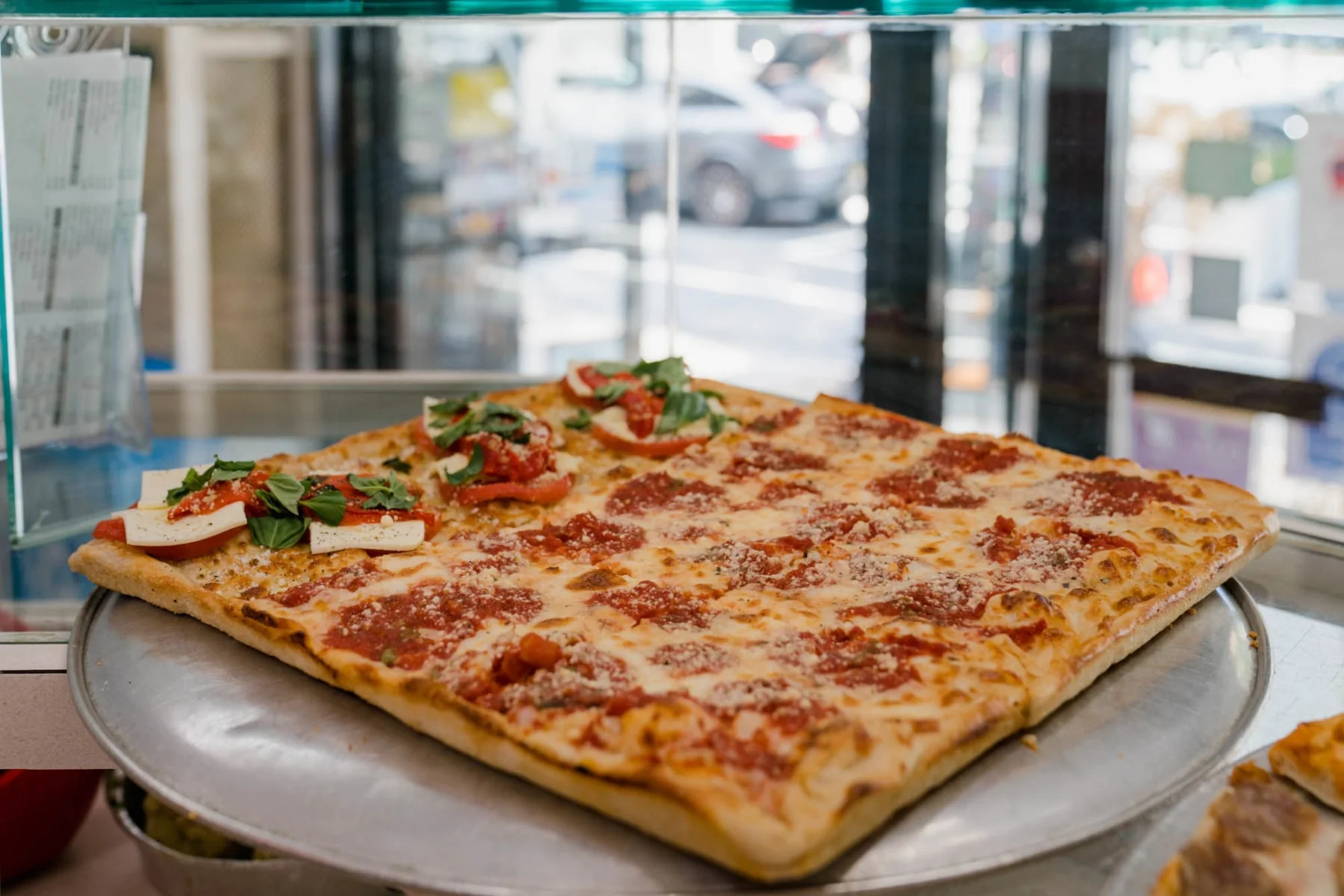 Sicilian-style pizza with fresh toppings
