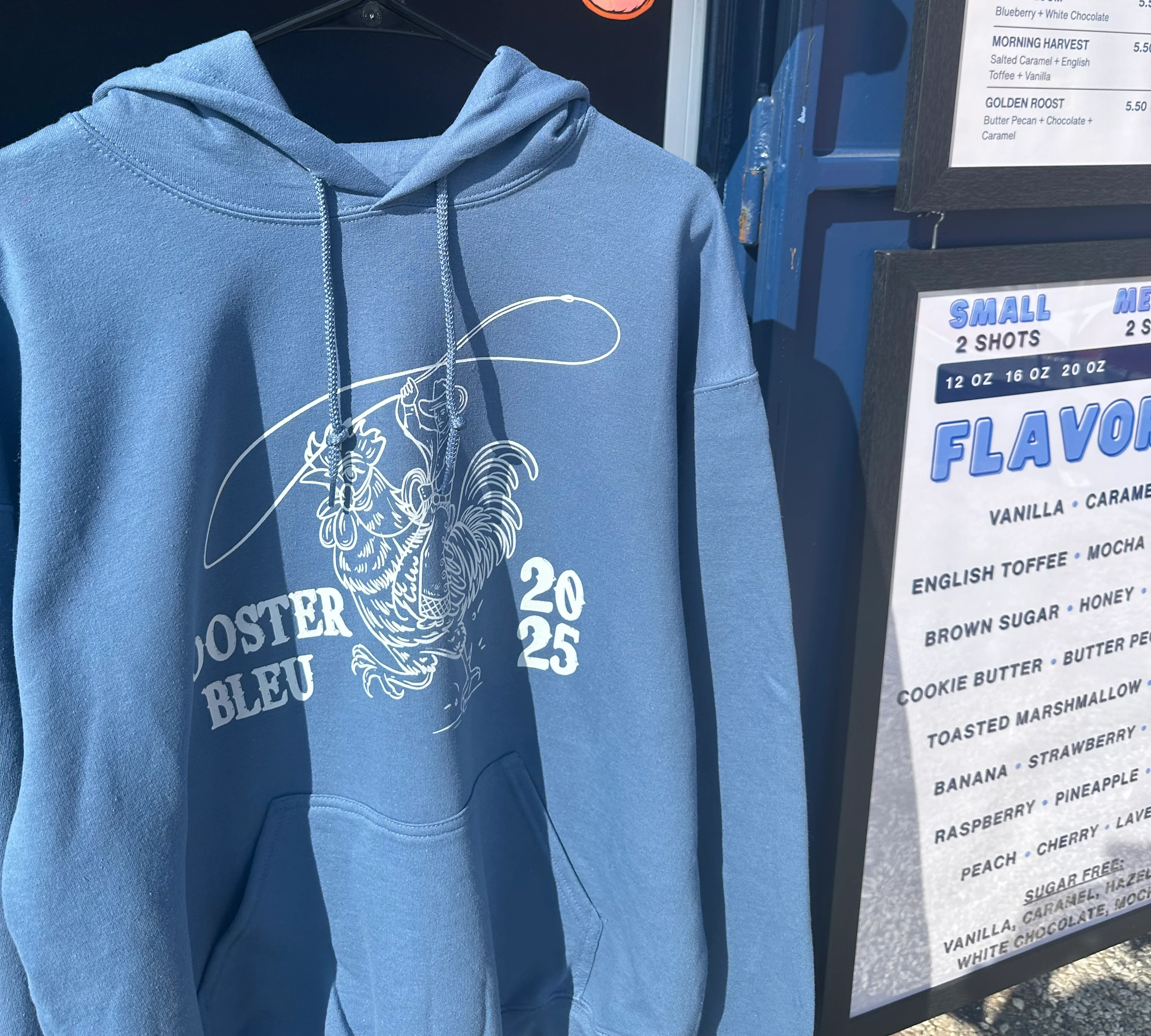 Blue hoodie featuring rooster design for Rooster Bleu 2025