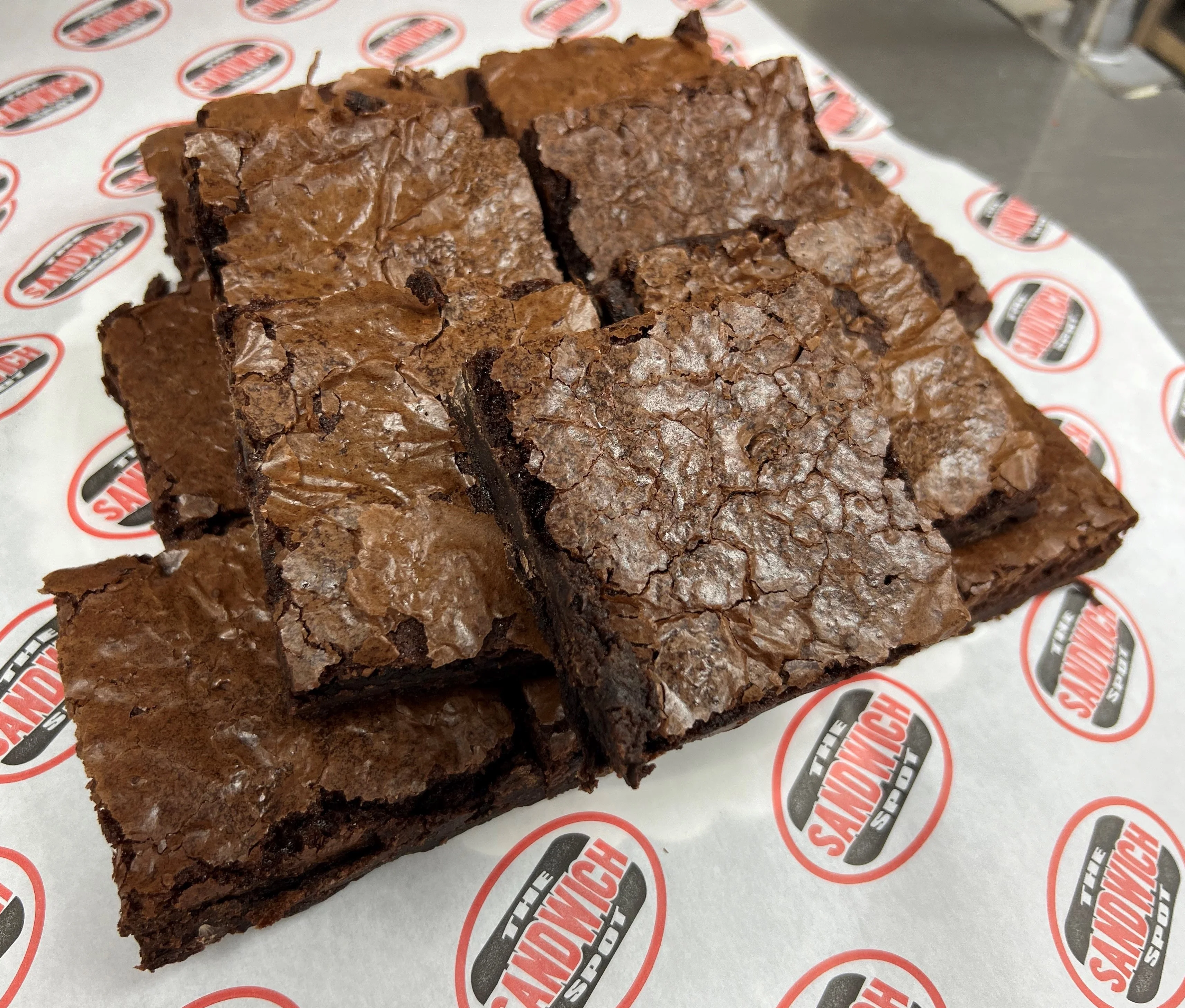 Decadent chocolate brownies on parchment paper