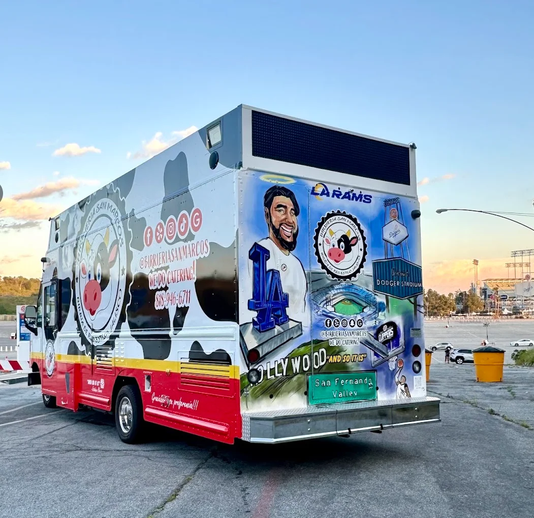 Colorful food truck featuring catering services and sports themes