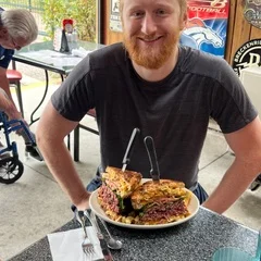 Giant Reuben sandwich served in a casual dining setting