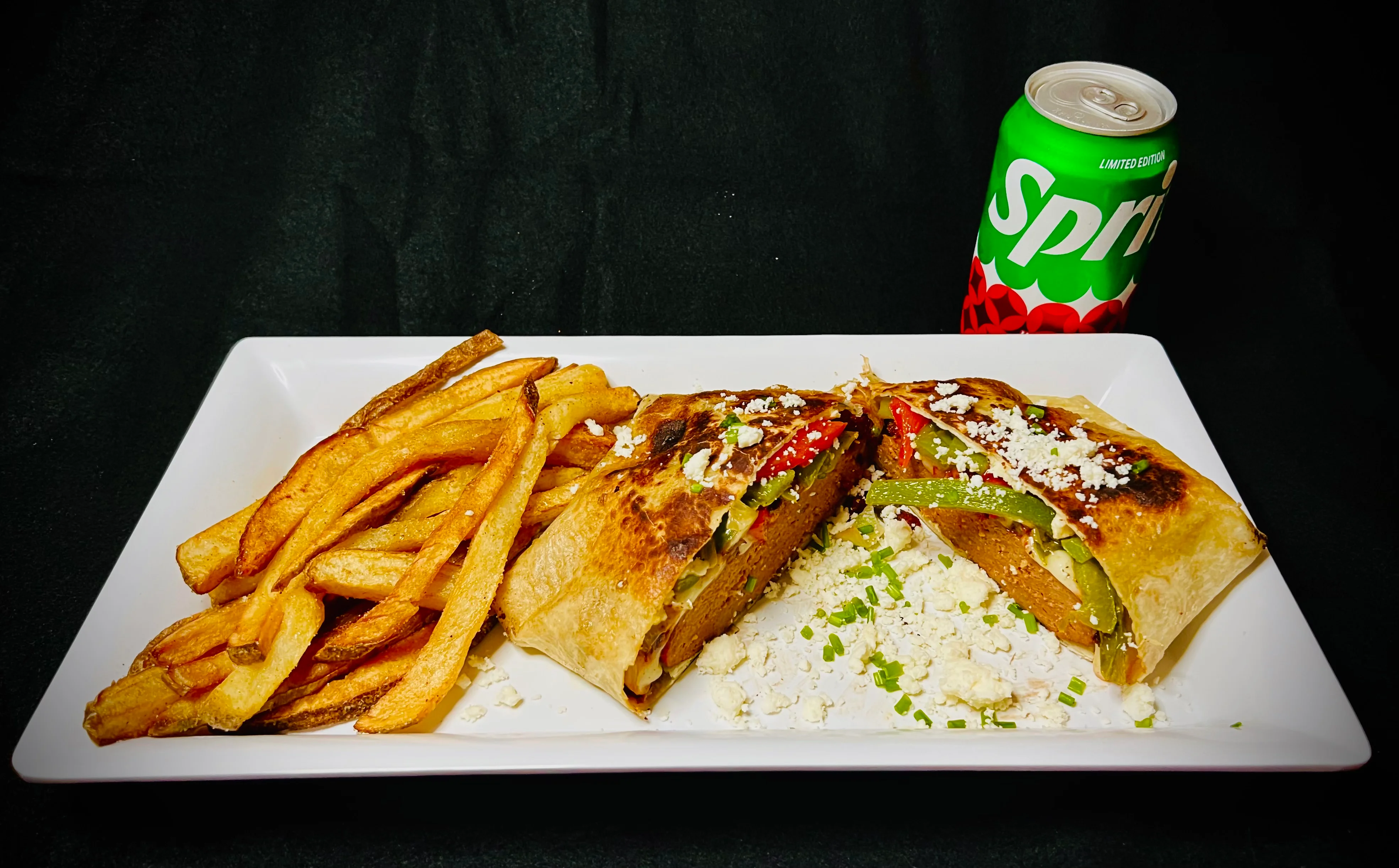 Delicious burrito with fries and soda