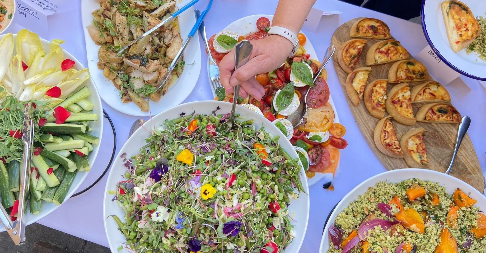 Colorful Mediterranean mezze platter with fresh salads and appetizers