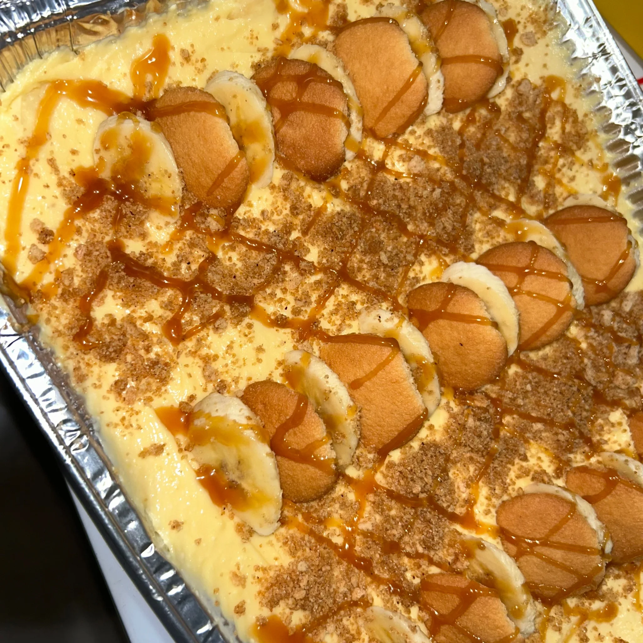 Classic Southern banana pudding dessert with caramel drizzle