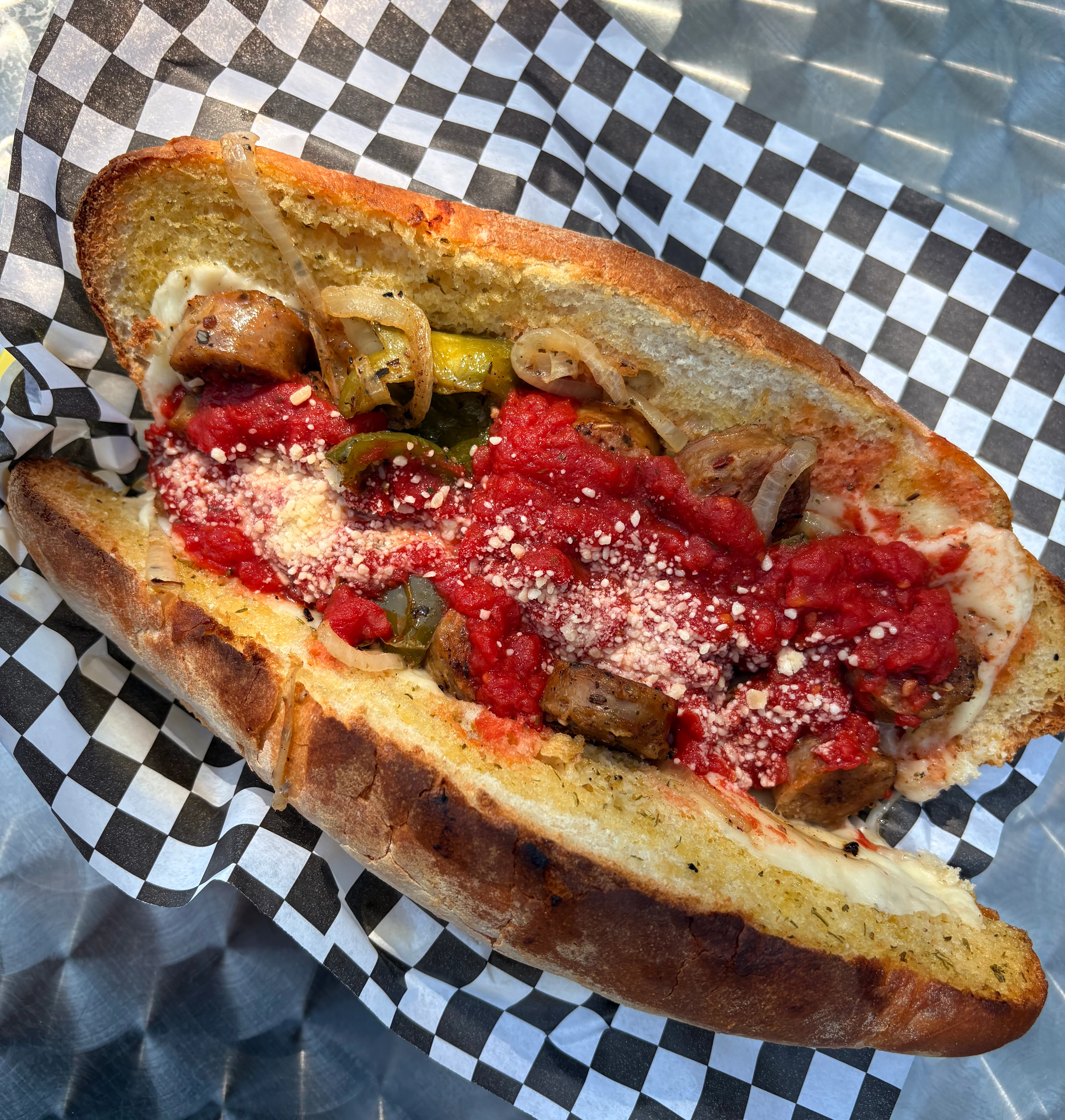 Italian sausage sandwich with marinara sauce