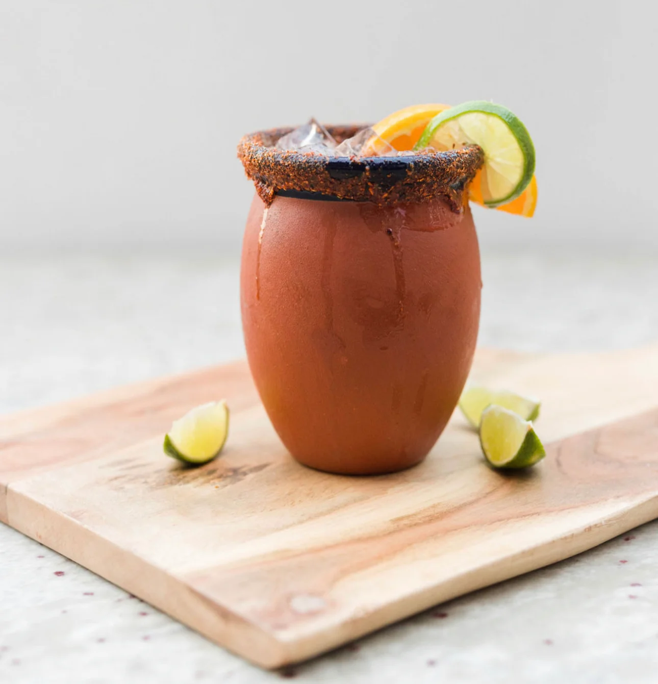 Traditional Mexican clay mug with a refreshing cocktail