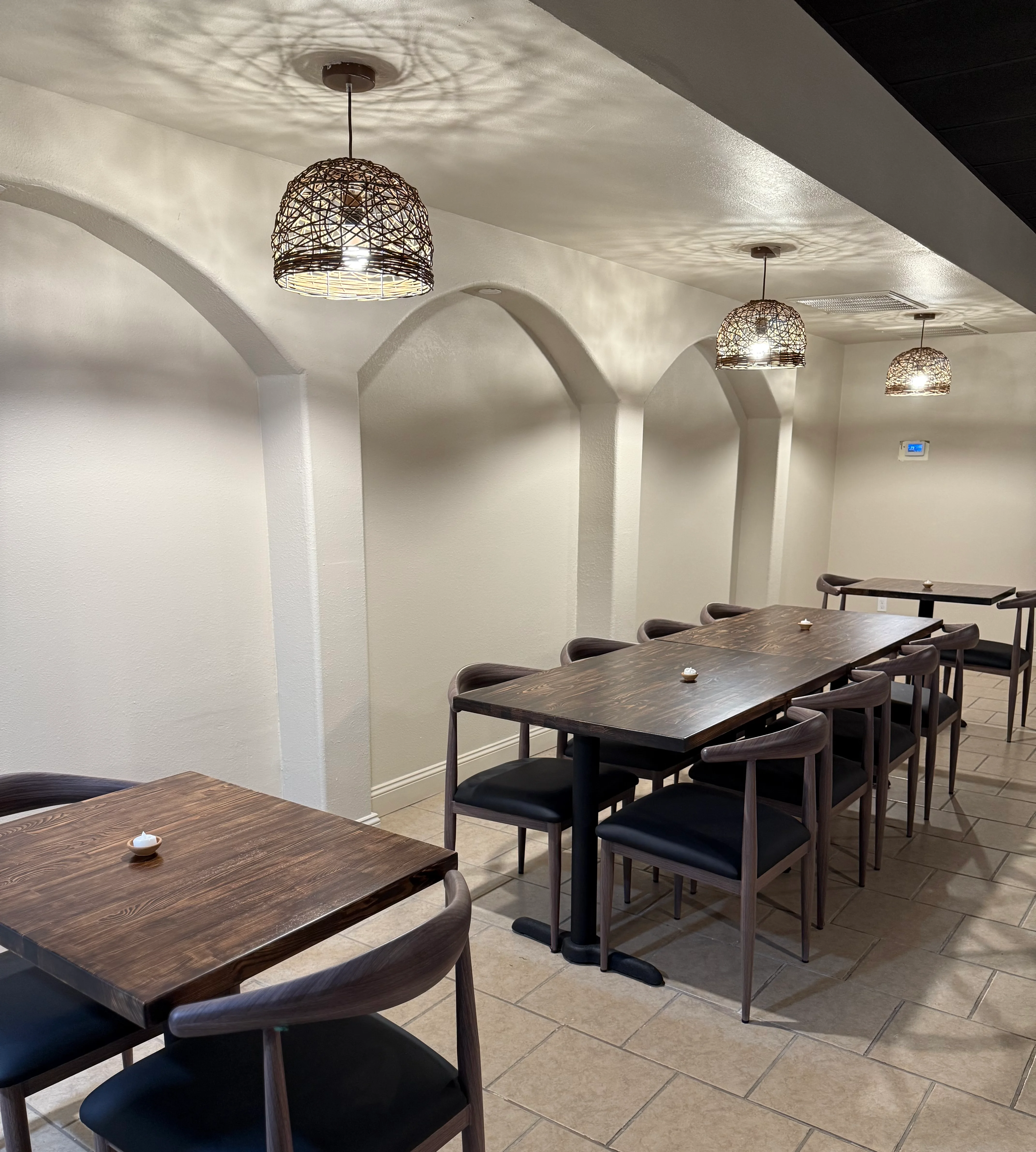 Cozy restaurant interior with modern wooden tables and warm lighting