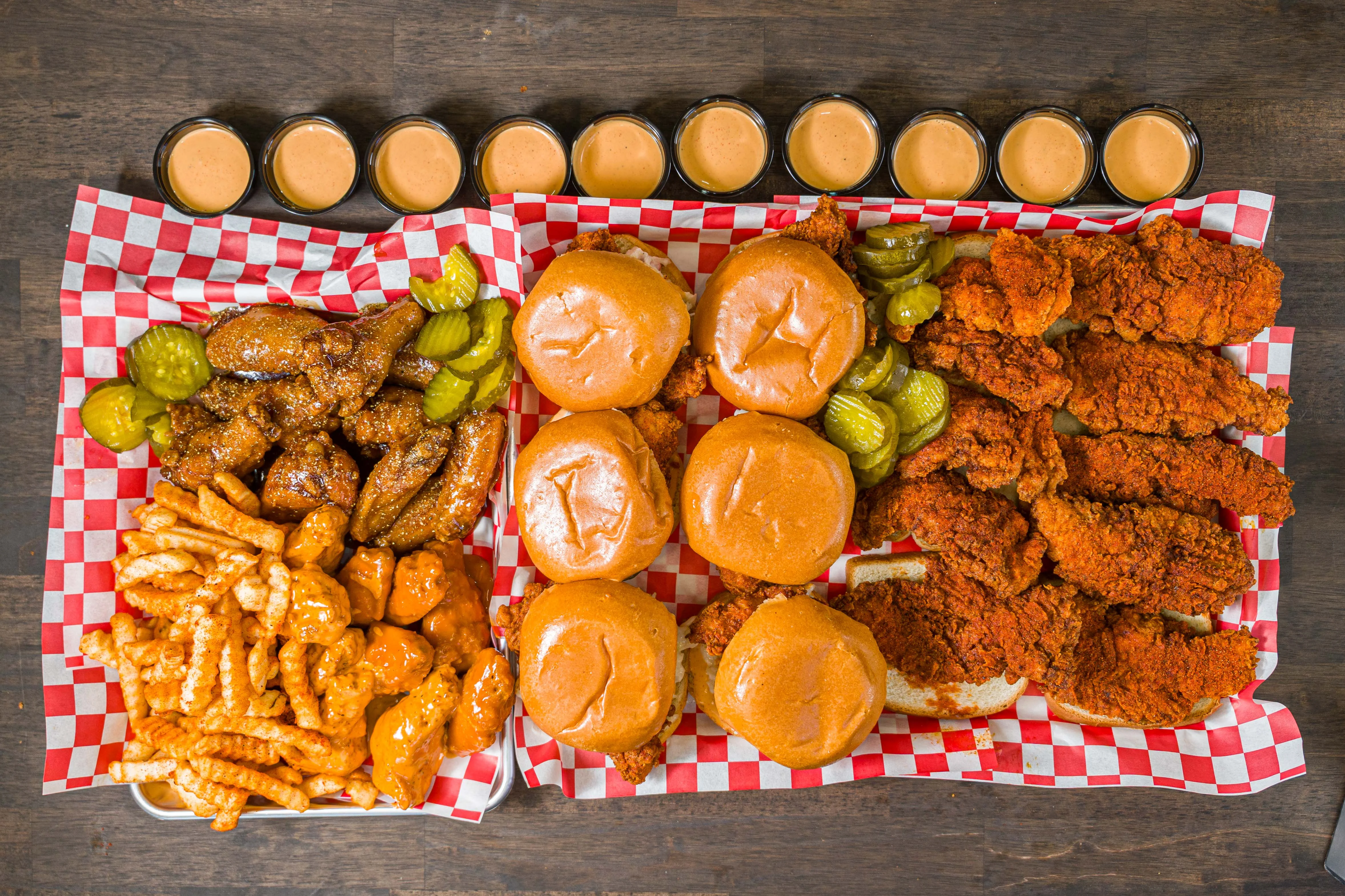 Southern fried chicken sandwiches with wings and dipping sauces