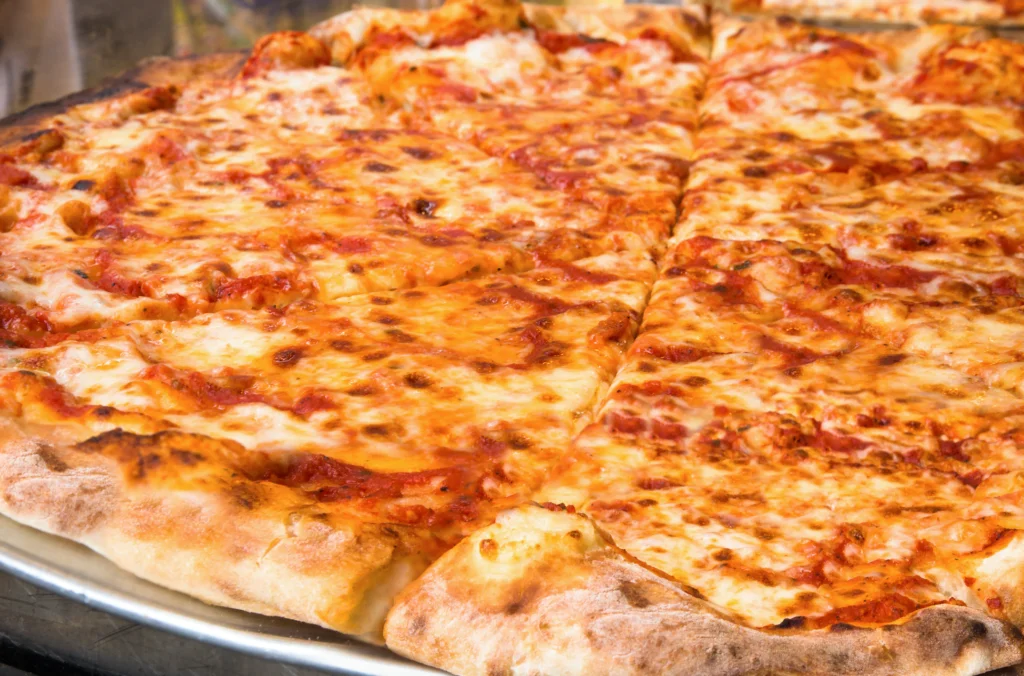 Cheesy Margherita pizza with golden crust
