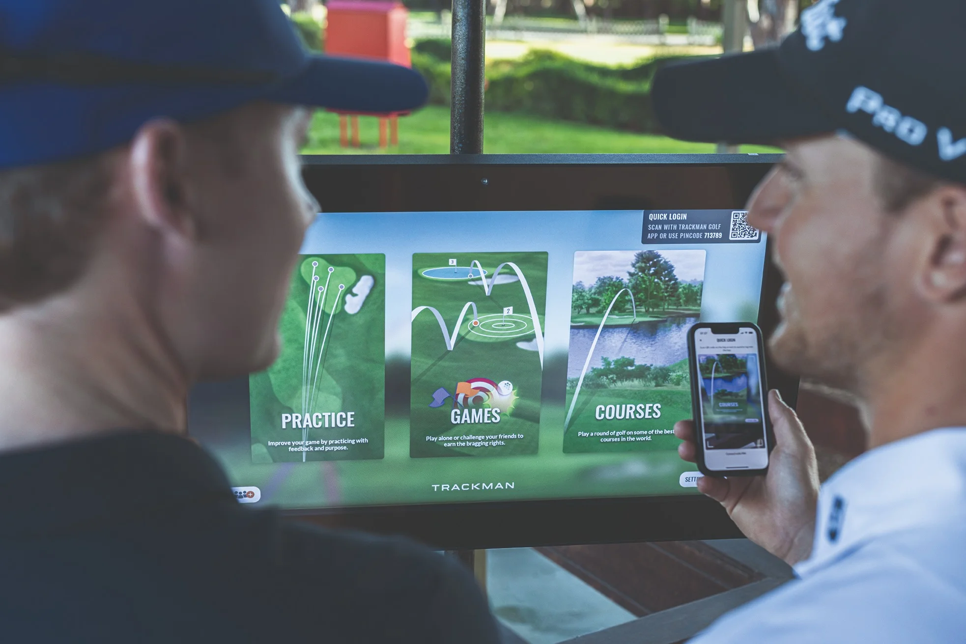 Golfers using Trackman technology for practice and games