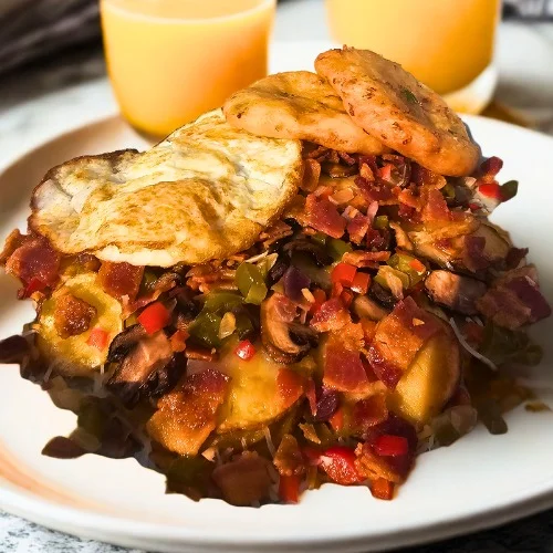 Hearty Dominican mangú topped with fried egg and bacon