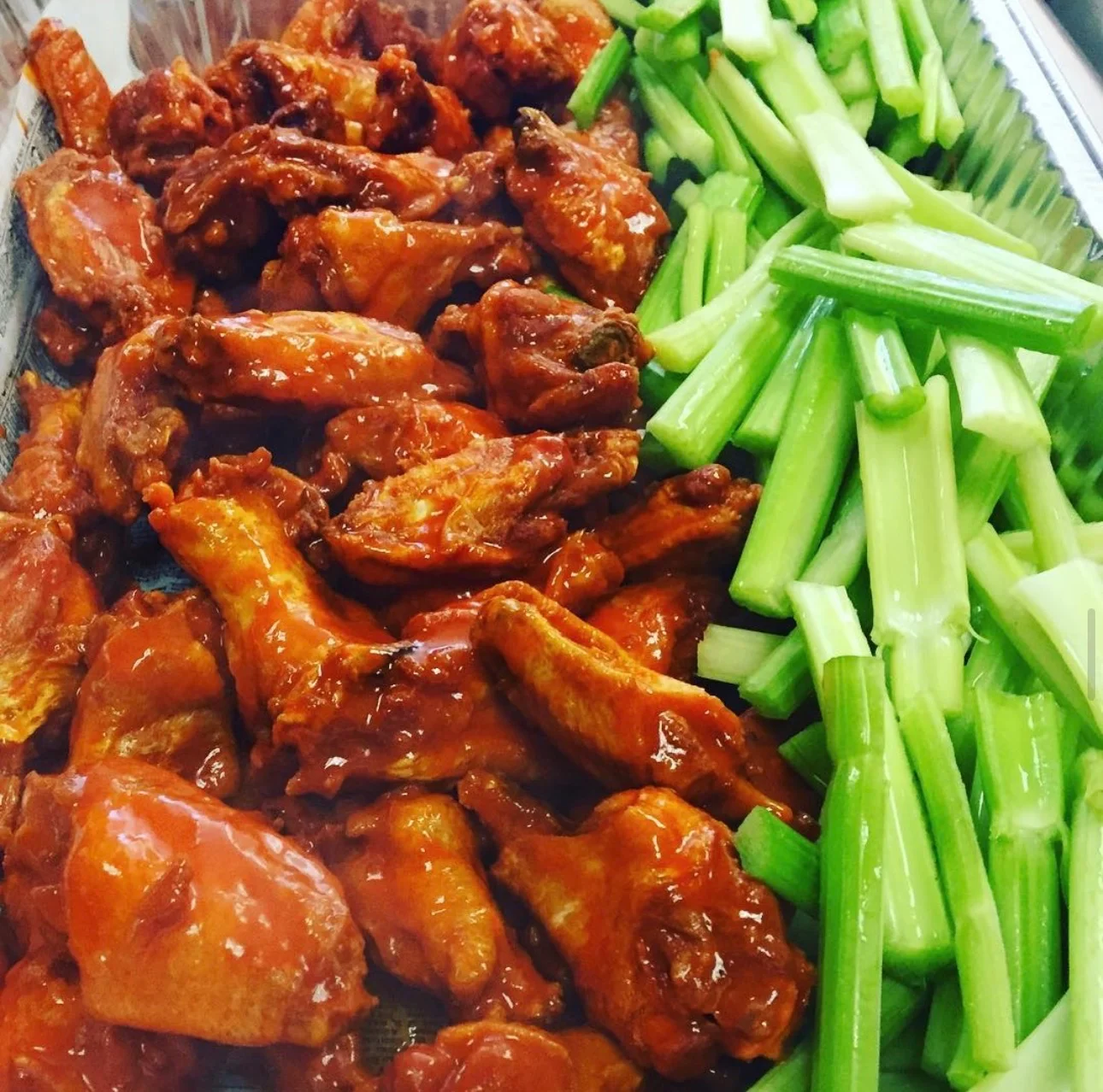 Buffalo chicken wings with celery sticks