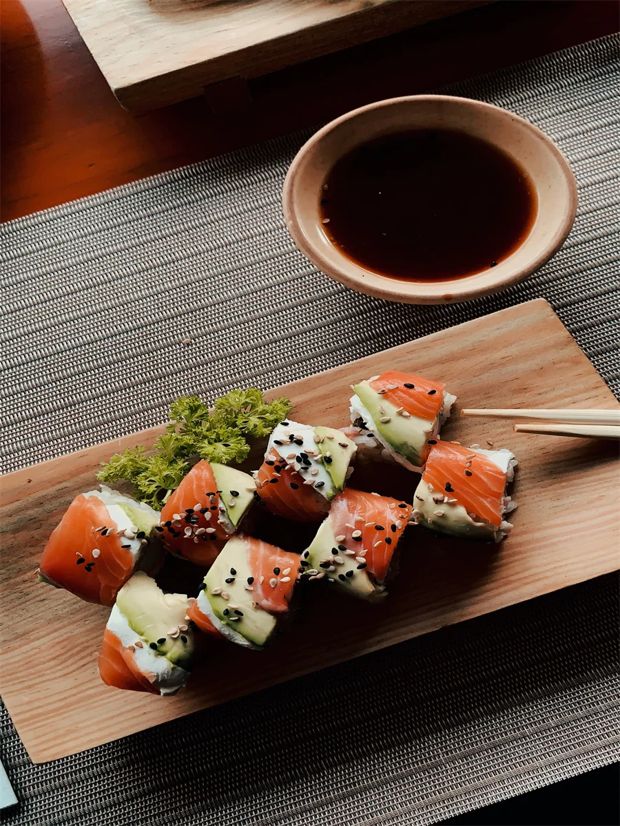 Japanese sushi rolls with salmon and avocado