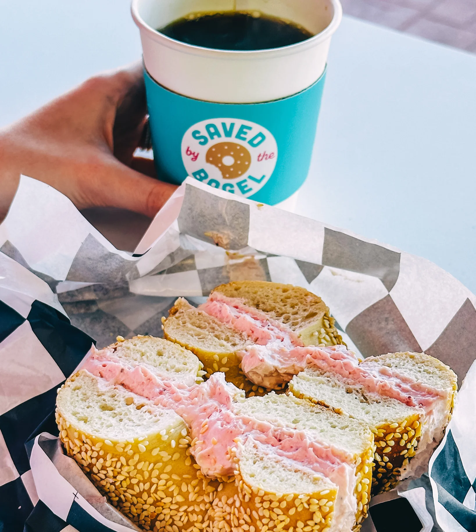 Sesame bagel with strawberry cream cheese