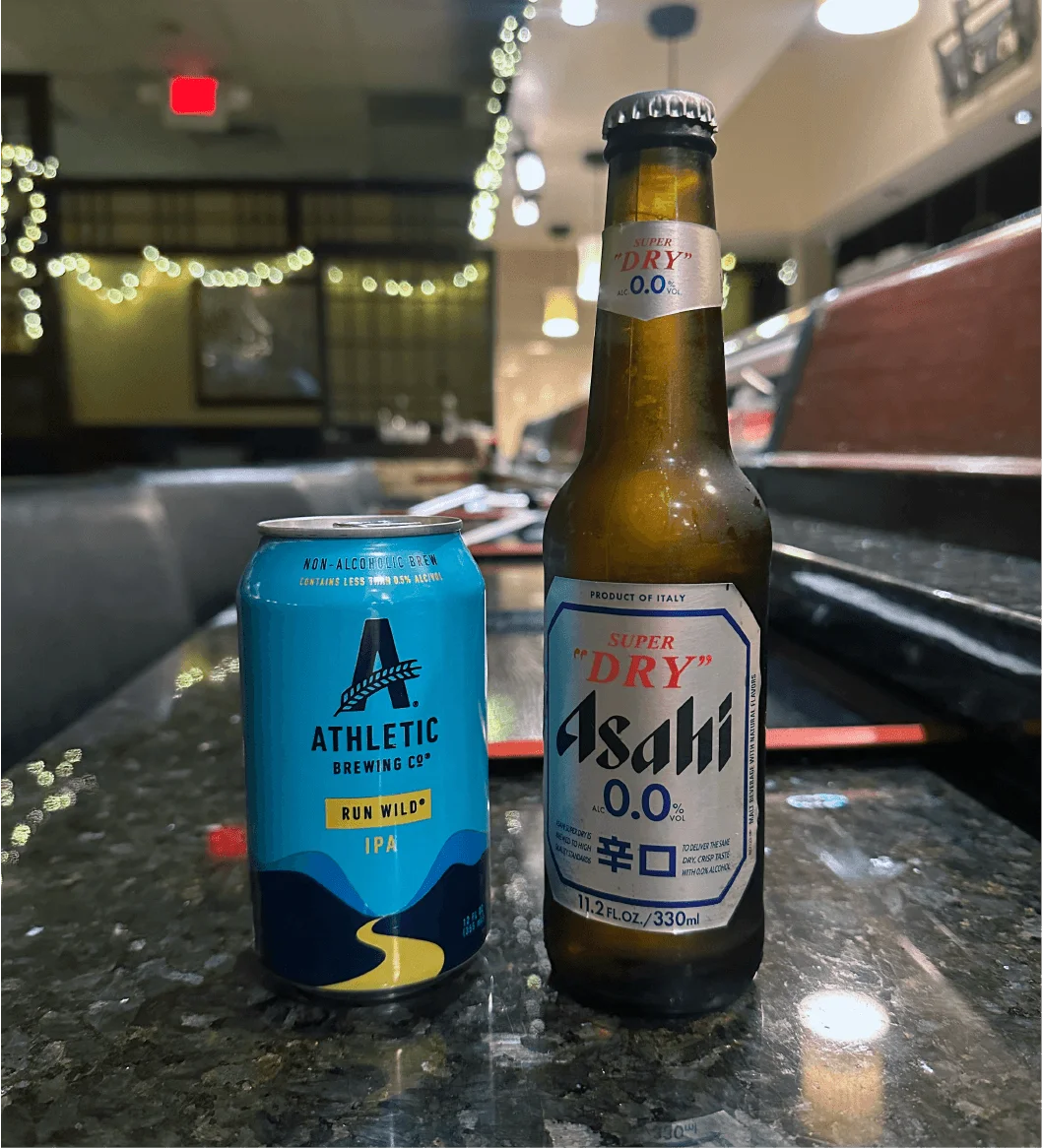 Non-alcoholic Asahi 0.0 and Athletic Brewing beers on the bar at Mahzu East Windsor
