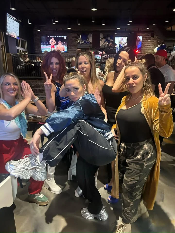 Group of friends enjoying a fun night out at a lively restaurant
