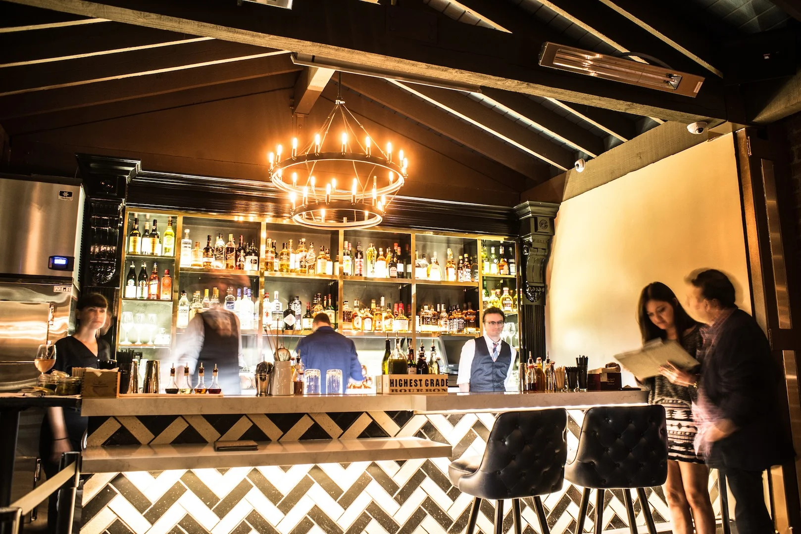 Stylish bar interior with cocktails and warm lighting