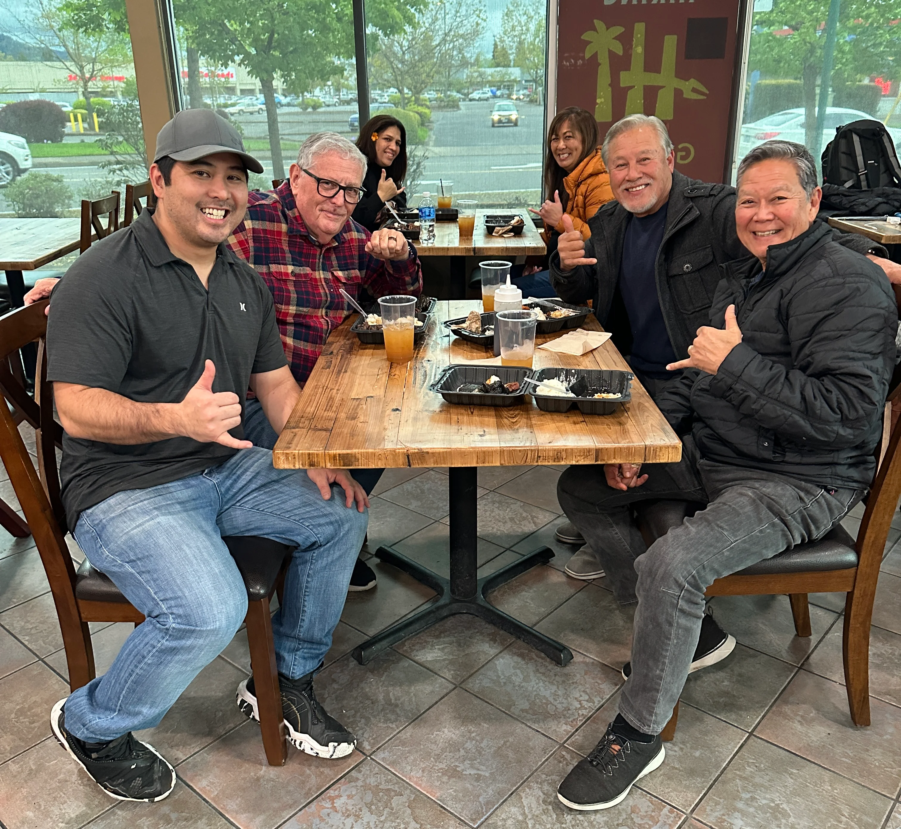 Group of friends enjoying a meal in a cozy restaurant setting