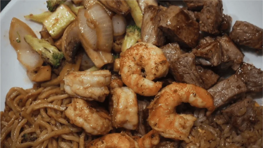 Close-up of hibachi steak, shrimp and vegetables over noodles at Mahzu East Windsor