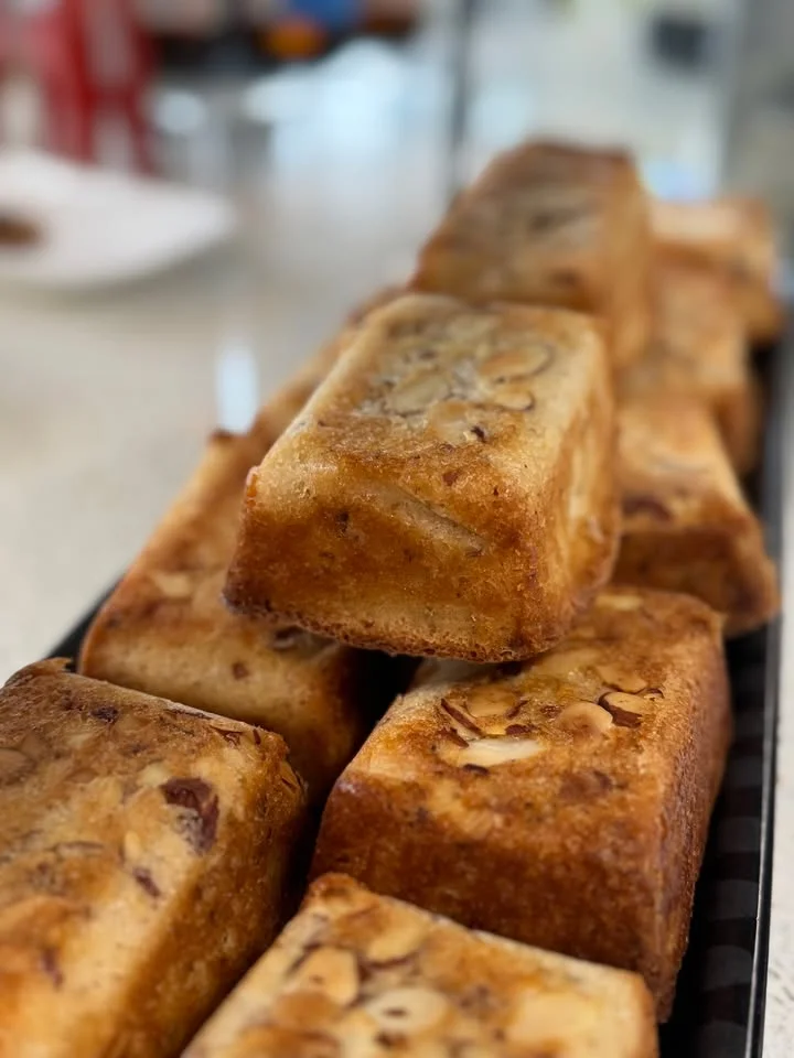 Freshly baked almond cake slices on a serving platter